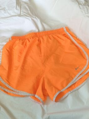 Nike Women's Neon Orange Athletic Shorts with Reflective Trim